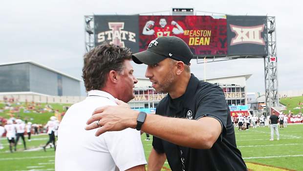 Iowa State Cyclones head coach Matt Campbell greets Oklahoma State Cowboys football head coach Mike Gundy before an NCAA college football game at Jack Trice Stadium on Saturday, Sept. 23, 2023, in Ames, Iowa.