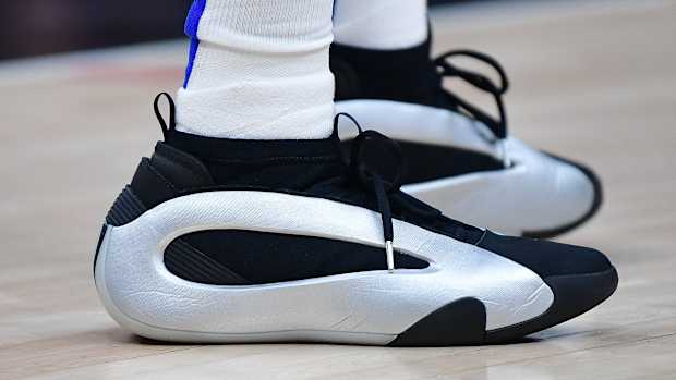 Los Angeles Clippers guard James Harden's silver and black adidas sneakers.