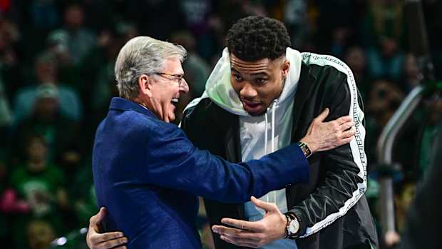Apr 7, 2023; Milwaukee, Wisconsin, USA; Milwaukee Bucks forward Giannis Antetokounmpo (34) hugs former Bucks general manager John Hammond who drafted Antetokounmpo 10 years ago