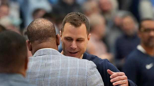 Duke basketball head coach Jon Scheyer versus UNC