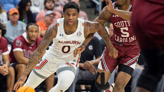 Auburn Tigers guard K.D. Johnson (0) drives the ball as Auburn Tigers men's basketball faces South Carolina Gamecocks at Neville Arena in Auburn, Ala., on Saturday, March 5, 2022.