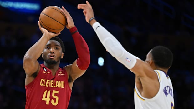 Los Angeles Lakers guard Russell Westbrook (0) guards a shot by Cleveland Cavaliers guard Donovan Mitchell (45) in the first half at Crypto.com Arena.