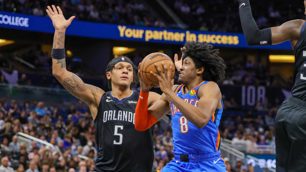 Jan 4, 2023; Orlando, Florida, USA; Oklahoma City Thunder forward Jalen Williams (8) drives to the basket against Orlando Magic forward Paolo Banchero (5) during the second quarter at Amway Center.