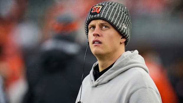 Injured Cincinnati Bengals quarterback Joe Burrow (9) walks the sideline in the fourth quarter of the NFL Week 12 game between the Cincinnati Bengals and the Pittsburgh Steelers at Paycor Stadium in Cincinnati on Sunday, Nov. 26, 2023. The Steelers took a 16-10 win over the Bengals in Cincinnati.  