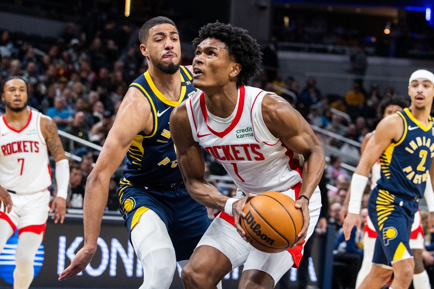 Rockets forward Amen Thompson (1) shoots the ball while Indiana Pacers guard Tyrese Haliburton (0) defends in the first half at Gainbridge Fieldhouse.