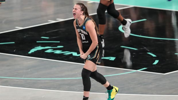 New York Liberty guard Sabrina Ionescu celebrates after a play.