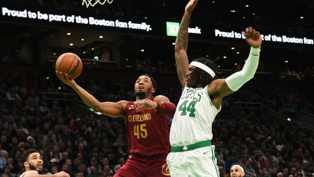 Mar 1, 2023; Boston, Massachusetts, USA; Cleveland Cavaliers guard Donovan Mitchell (45) drives to the basket while Boston Celtics center Robert Williams III (44) defends during the second half at TD Garden. Mandatory Credit: Bob DeChiara-USA TODAY Sports