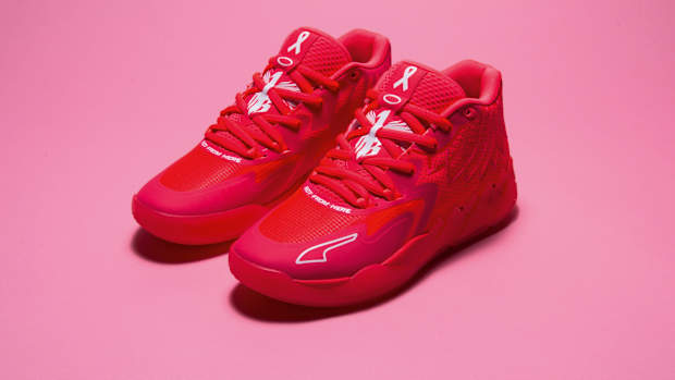 Side view of LaMelo Ball's pink PUMA basketball shoes.