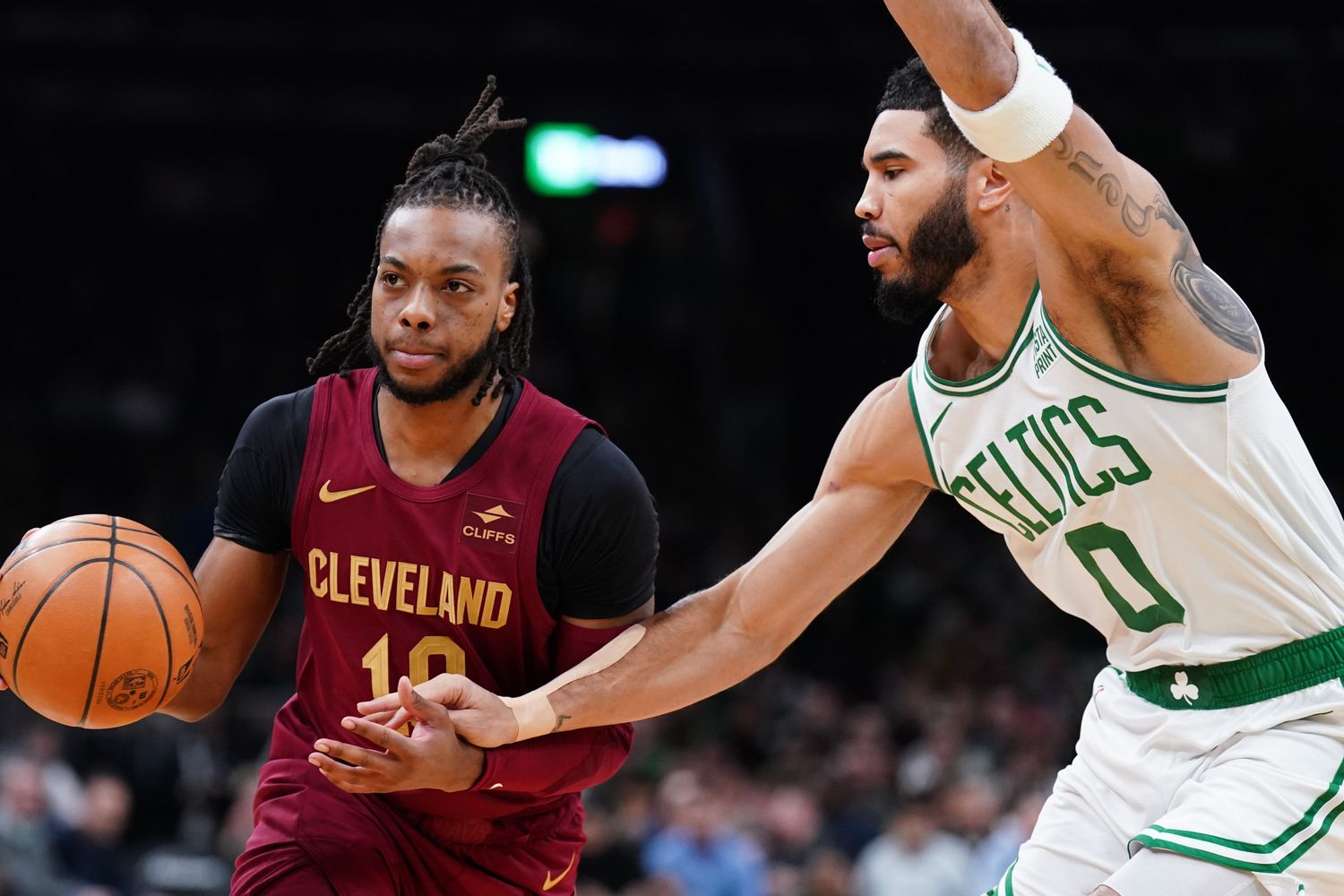 Dec 14, 2023; Boston, Massachusetts, USA; Cleveland Cavaliers guard Darius Garland (10) drives the ball against Boston Celtics forward Jayson Tatum (0) in the first quarter at TD Garden.