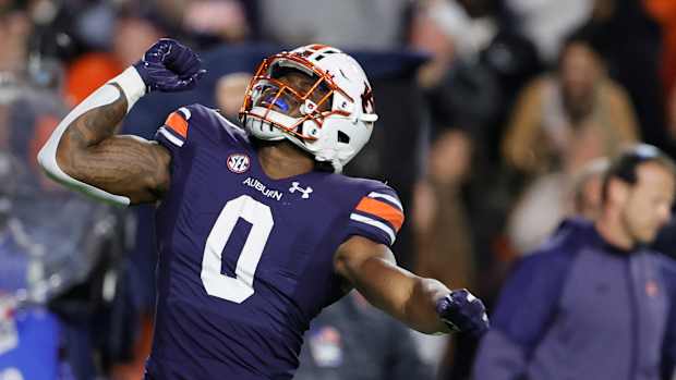 Oct 30, 2021; Auburn, Alabama, USA; Auburn Tigers linebacker Owen Pappoe (0) celebrates after a tackle for a loss against the Mississippi Rebels during the first quarter at Jordan-Hare Stadium. Mandatory Credit: John Reed-USA TODAY Sports