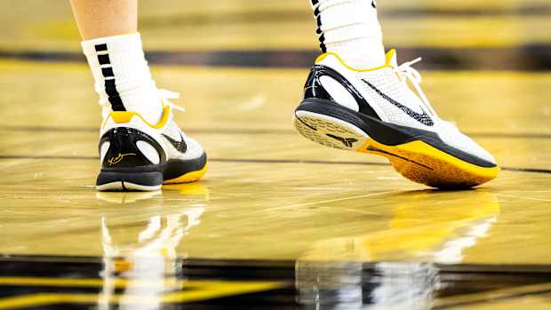 Iowa Hawkeyes guard Caitlin Clark's white and black Nike Kobe sneakers.