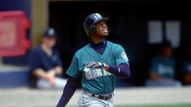Seattle Mariners outfielder Ken Griffey Jr. hits a home run.