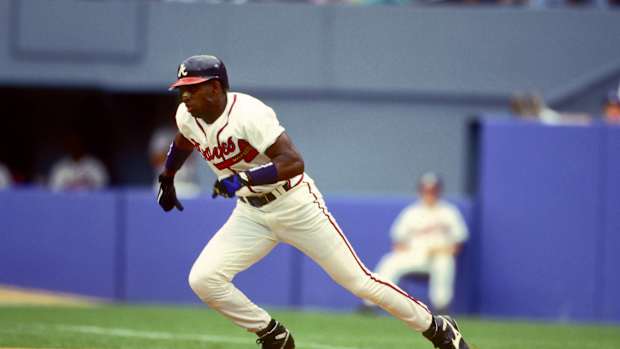 Atlanta Braves outfielder Deion Sanders steals second base.