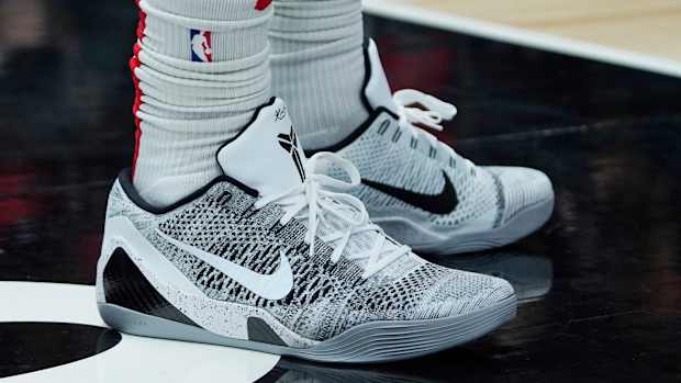 View of white and black Nike Kobe shoes.