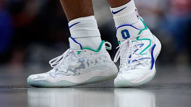 View of Tyrese Maxey's white New Balance shoes.