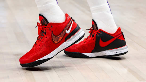 View of LeBron James' red and black Nike shoes.