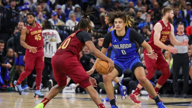 Dec 11, 2023; Orlando, Florida, USA; Orlando Magic guard Anthony Black (0) defends Cleveland Cavaliers guard Darius Garland (10) during the second half at Amway Center. Mandatory Credit: Mike Watters-USA TODAY Sports