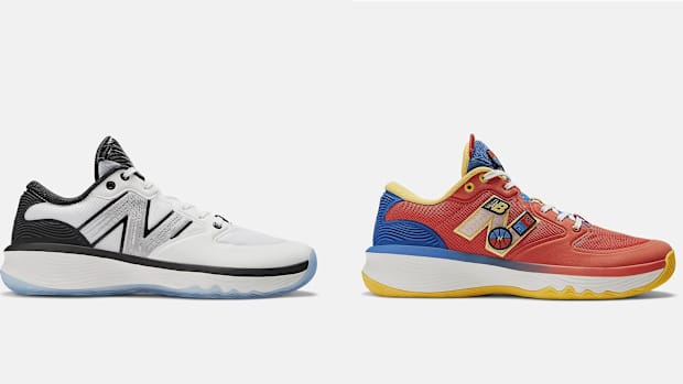 Side view of white and red New Balance sneakers.