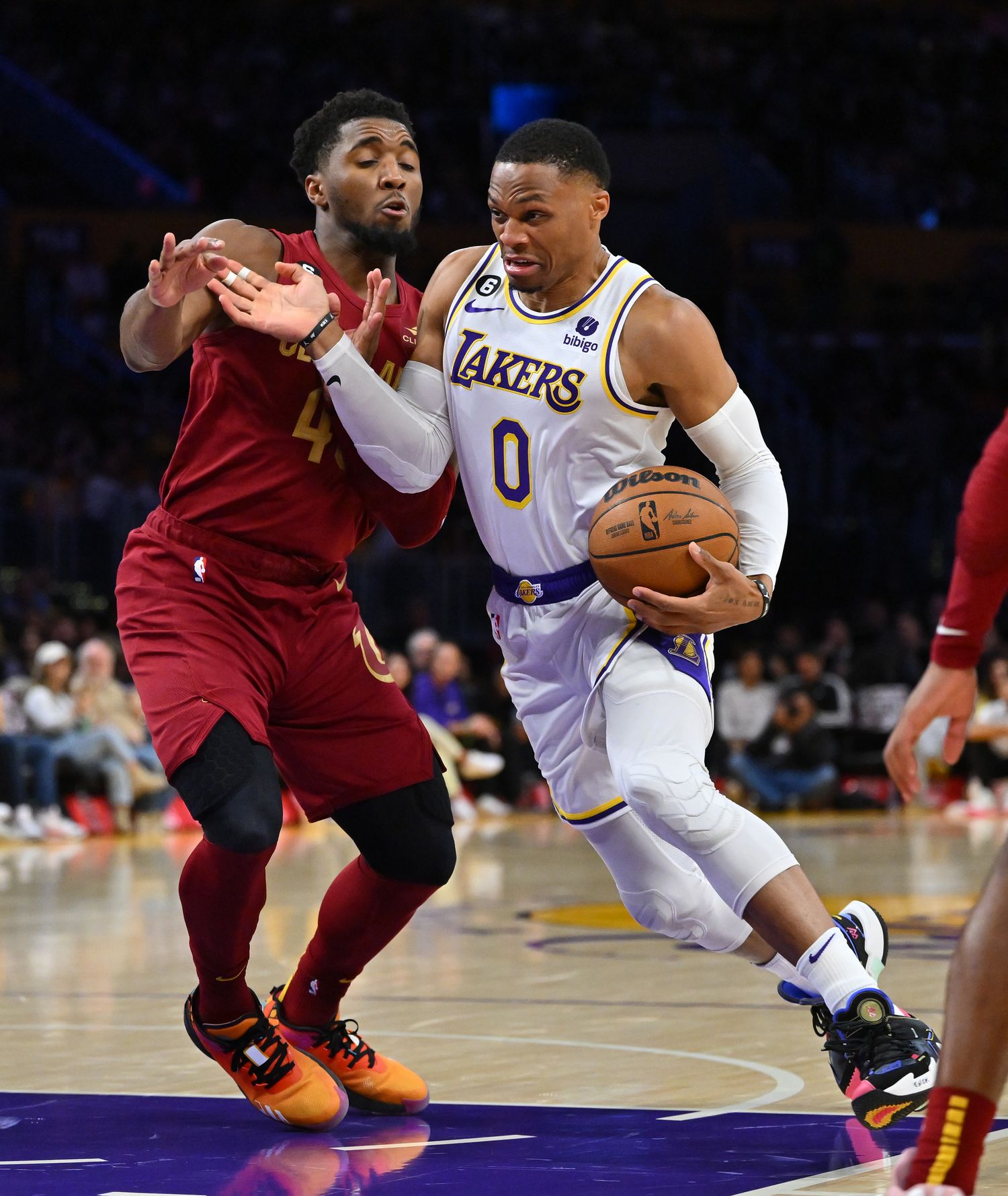 Los Angeles Lakers guard Russell Westbrook (0) is defended by Cleveland Cavaliers guard Donovan Mitchell (45) as he drives to the basket in the second half at Crypto.com Arena.