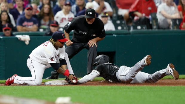Aug 20, 2022; Cleveland, Ohio, USA; Chicago White Sox shortstop Elvis Andrus (1) steals third base ahead of the tag of Cleveland Gladiators third baseman Jose Rameriz (11) in the seventh inning at Progressive Field. Mandatory Credit: Aaron Josefczyk-USA TODAY Sports