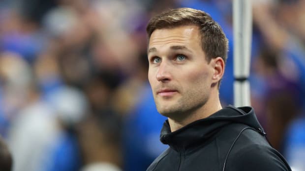 Vikings quarterback Kirk Cousins watches the game from the bench.