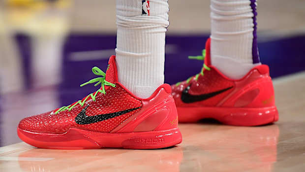 View of Anthony Davis' red and black Nike Kobe shoes.