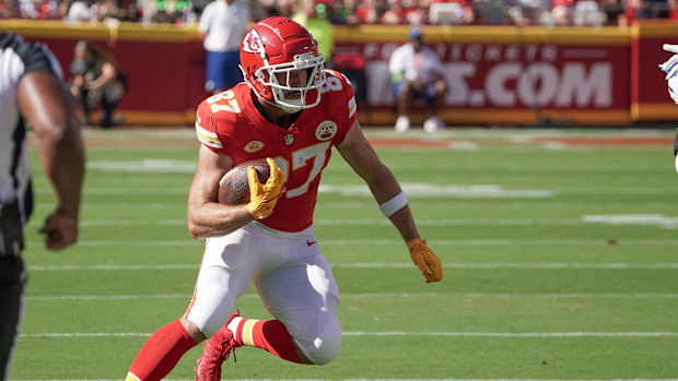Kansas City Chiefs tight end Travis Kelce runs with the football.
