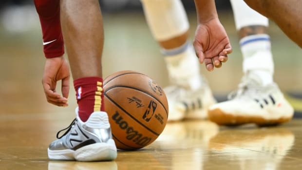 Nov 28, 2023; Cleveland, Ohio, USA; Cleveland Cavaliers guard Darius Garland (10) picks up the ball in the second quarter against the Atlanta Hawks at Rocket Mortgage FieldHouse.