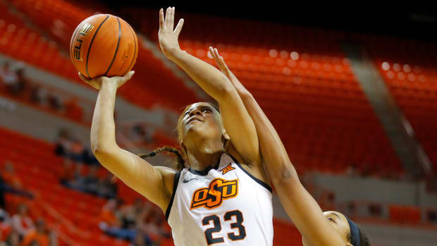 Oklahoma State Cowgirls guard Lauren Fields (23) puts up a shot beside Oklahoma Sooners forward Nydia Lampkin (21) during a women's Bedlam basketball game between the Oklahoma State University Cowgirls (OSU) and the University of Oklahoma Sooners (OU) at Gallagher-Iba Arena in Stillwater, Okla., Wednesday, March 2, 2022. Women's Bedlam Basketball