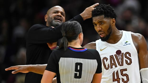 Oct 27, 2023; Cleveland, Ohio, USA; Cleveland Cavaliers guard Donovan Mitchell (45) and head coach J. B. Bickerstaff talk to referee Natalie Sago (9) in the third quarter against the Oklahoma City Thunder at Rocket Mortgage FieldHouse.