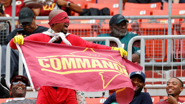 Washington Commanders fans cheer on their team at FedEx Field.