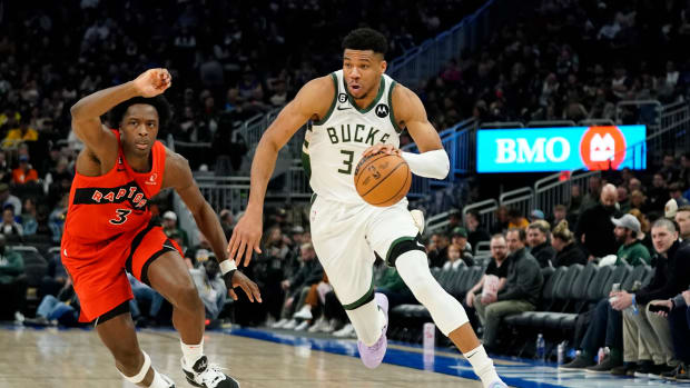 Giannis Antetokounmpo drives to the basket against Toronto Raptors’ O.G. Anunoby