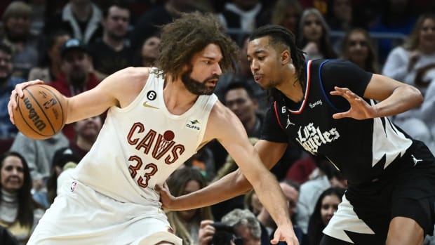 Jan 29, 2023; Cleveland, Ohio, USA; Cleveland Cavaliers center Robin Lopez (33) drives to the basket against Los Angeles Clippers center Moses Brown (9) during the second half at Rocket Mortgage FieldHouse. Mandatory Credit: Ken Blaze-USA TODAY Sports