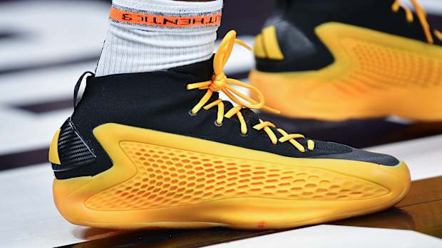 Minnesota Timberwolves guard Anthony Edwards' gold and black adidas sneakers.