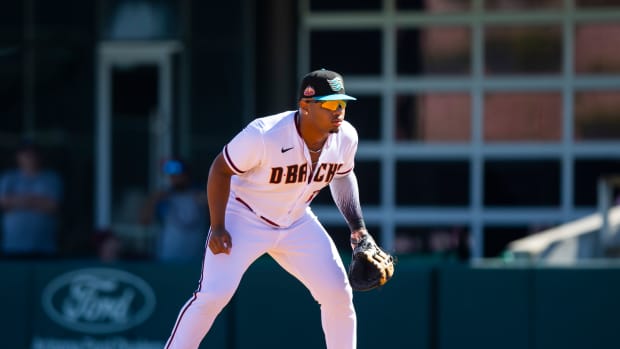 Oct 22, 2022; Phoenix, Arizona, USA; Arizona Diamondbacks first baseman Deyvison De Los Santos plays for the Salt River Rafters during an Arizona Fall League baseball game at Phoenix Municipal Stadium.