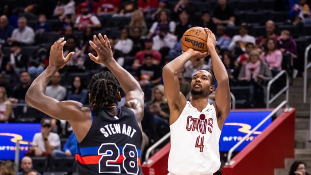 Nov 4, 2022; Detroit, Michigan, USA; Cleveland Cavaliers forward Evan Mobley (4) shoots a 3-pointer against Detroit Pistons center Isaiah Stewart (28) in the first quarter at Little Caesars Arena.