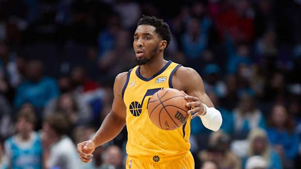 Donovan Mitchell dribbles the ball.