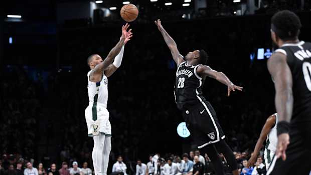 Milwaukee Bucks guard Damian Lillard (0) shoots the ball against Brooklyn Nets forward Dorian Finney-Smith (28)