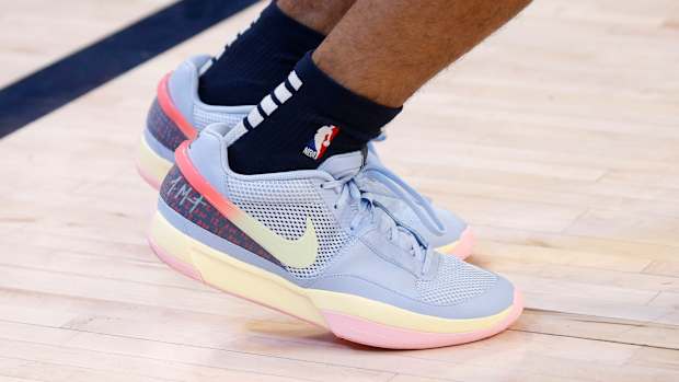 View of Ja Morant's blue, yellow, and pink Nike shoes.