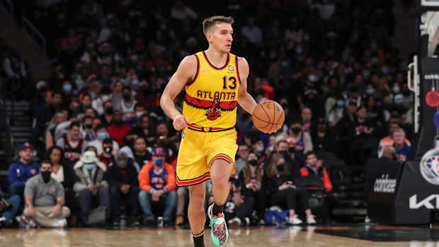 Bogdan Bogdanovic dribbles the ball.