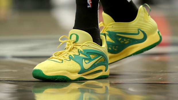 View of Kevin Durant's yellow and green shoes.
