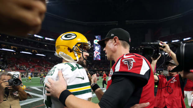 Green Bay Packers quarterback Aaron Rodgers and Atlanta Falcons quarterback Matt Ryan following a game.