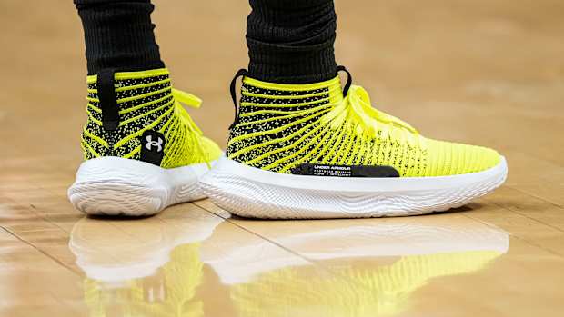 Atlanta Hawks guard Patty Mills' yellow and white Under Armour shoes.