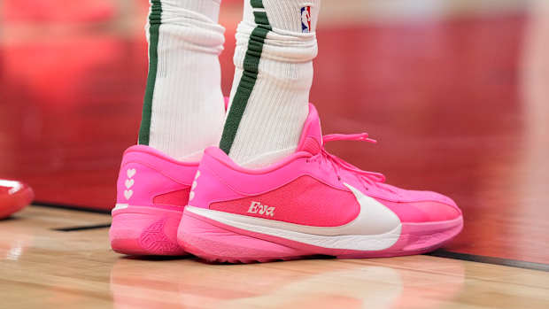 Milwaukee Bucks forward Giannis Antetokounmpo's pink and white Nike sneakers.
