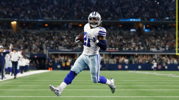 Dallas Cowboys running back Ezekiel Elliott scores a touchdown.