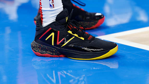 Atlanta Hawks guard Dejounte Murray's black and red New Balance sneakers.