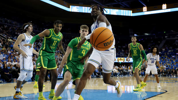 UCLA Bruins forward Kenneth Nwuba chases the loose ball against the Oregon Ducks.