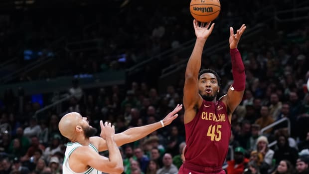 Dec 12, 2023; Boston, Massachusetts, USA; Cleveland Cavaliers guard Donovan Mitchell (45) shoots against Boston Celtics guard Derrick White (9) in the second quarter at TD Garden.