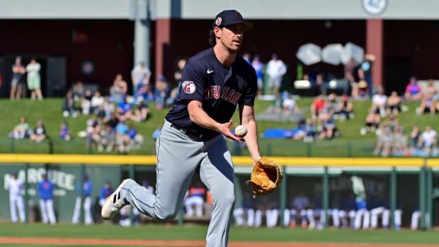 Feb 27, 2023; Mesa, Arizona, USA; Cleveland Guardians starting pitcher Shane Bieber (57) throws to first base in the first inning against the Chicago Cubs during a spring training game at Sloan Park. Mandatory Credit: Matt Kartozian-USA TODAY Sports