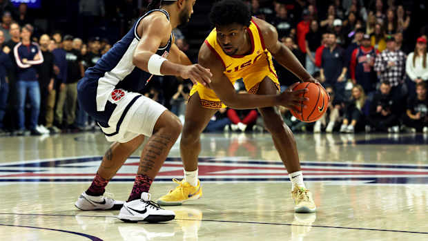 USC Trojans guard Bronny James dribbles against Arizona Wildcats guard Kylan Boswell.